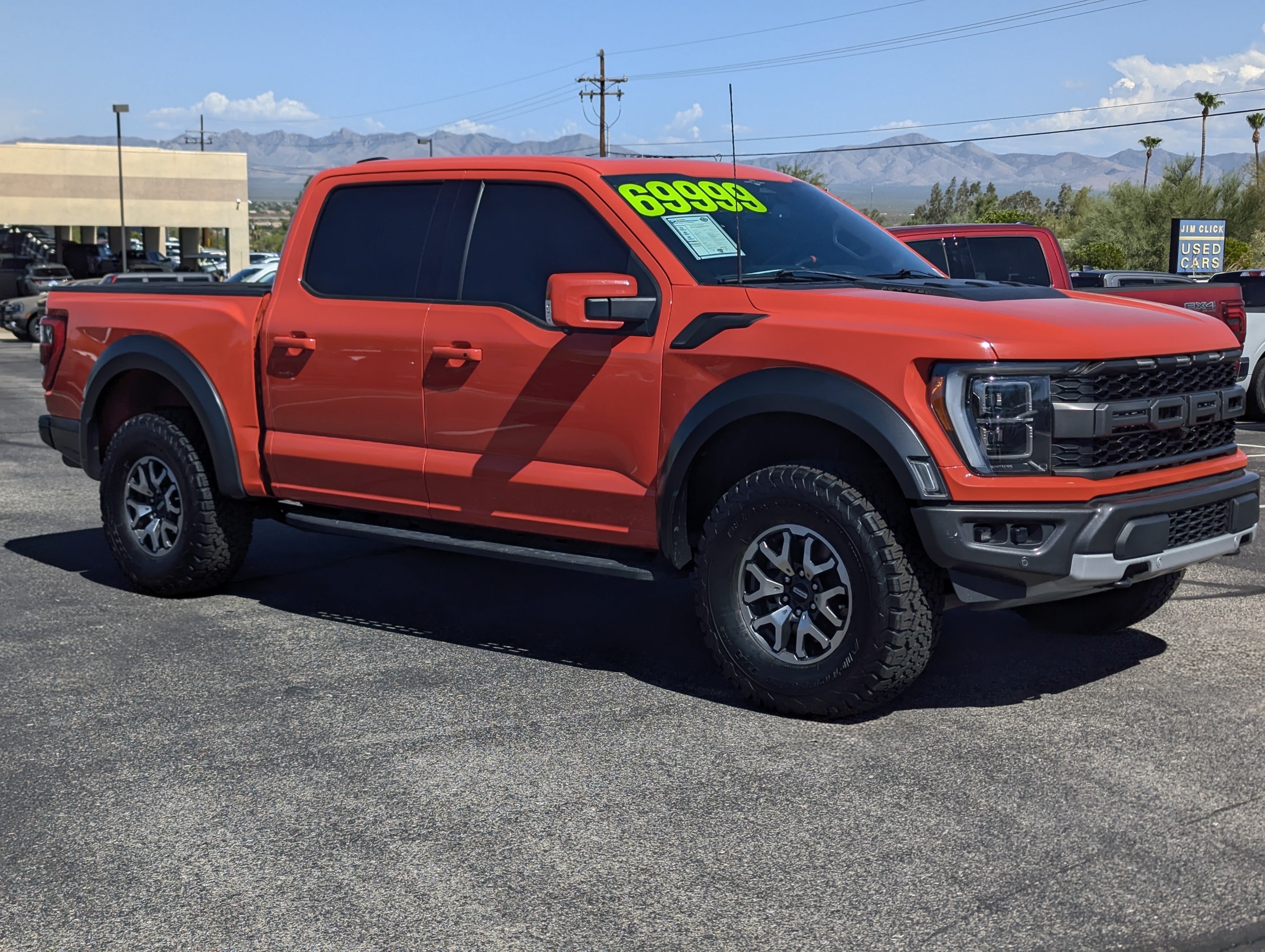 2023 Ford F-150 Raptor in Orange — front three-quarter view