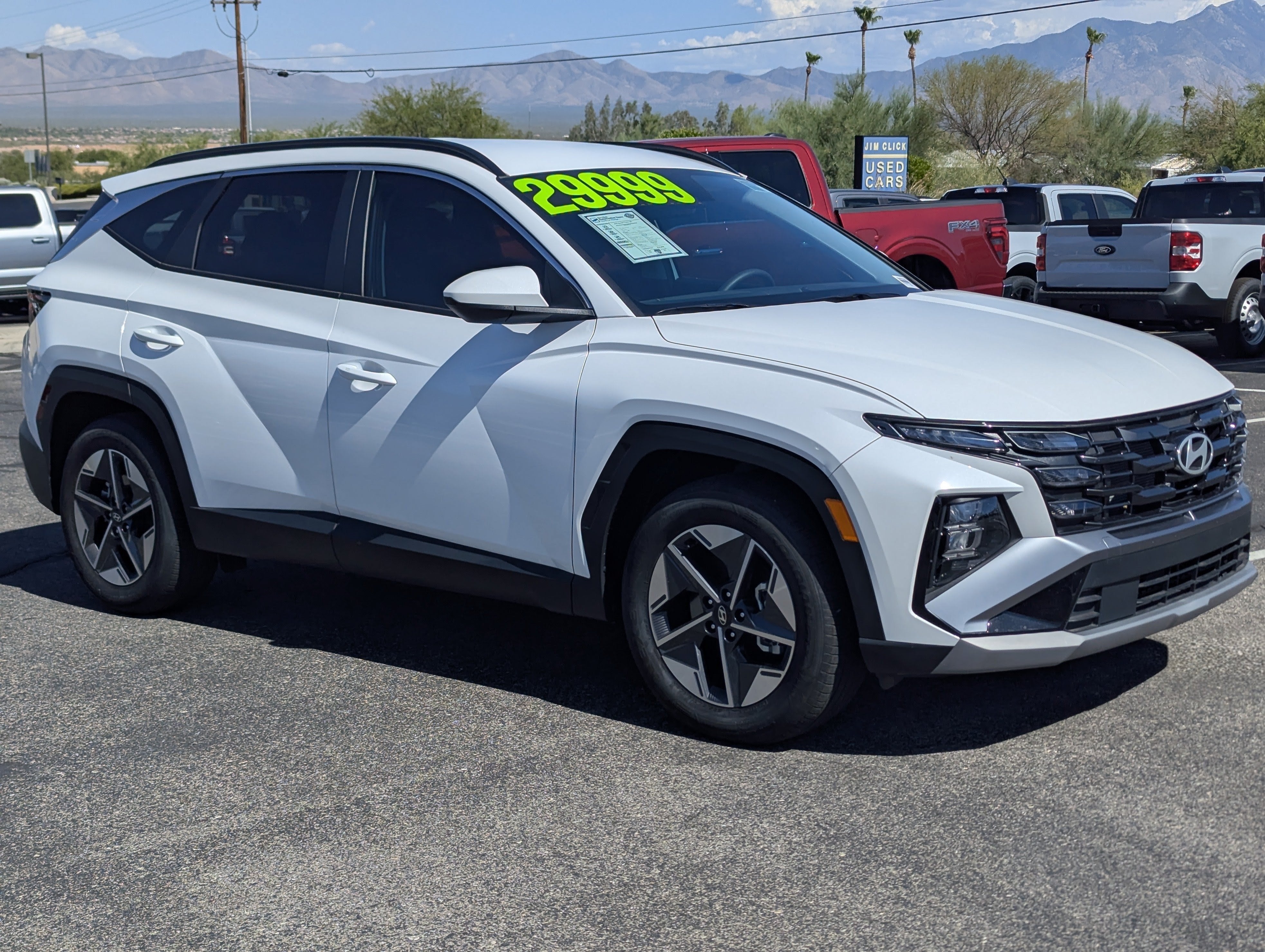 2025 Hyundai TUCSON SEL in Serenity White Pearl — front three-quarter view